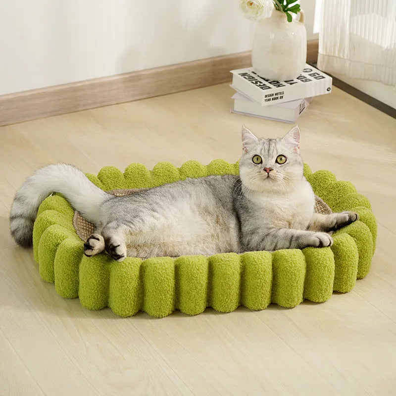 Green oval cat scratch pad bed with sisal scratching surface measuring 650x420mm