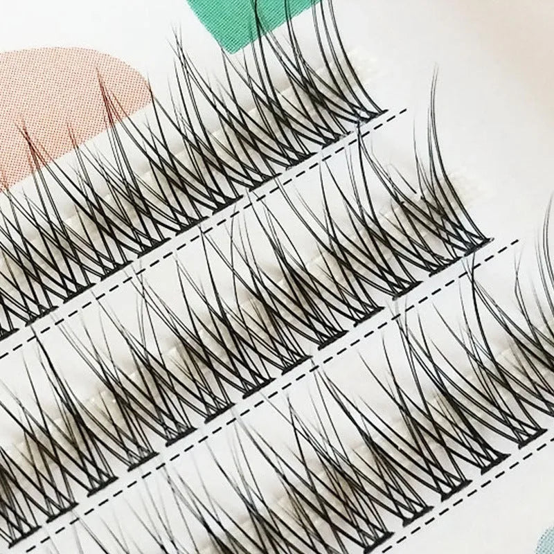 Black V-shaped fairy fishtail false eyelashes showing segmented design in natural long style