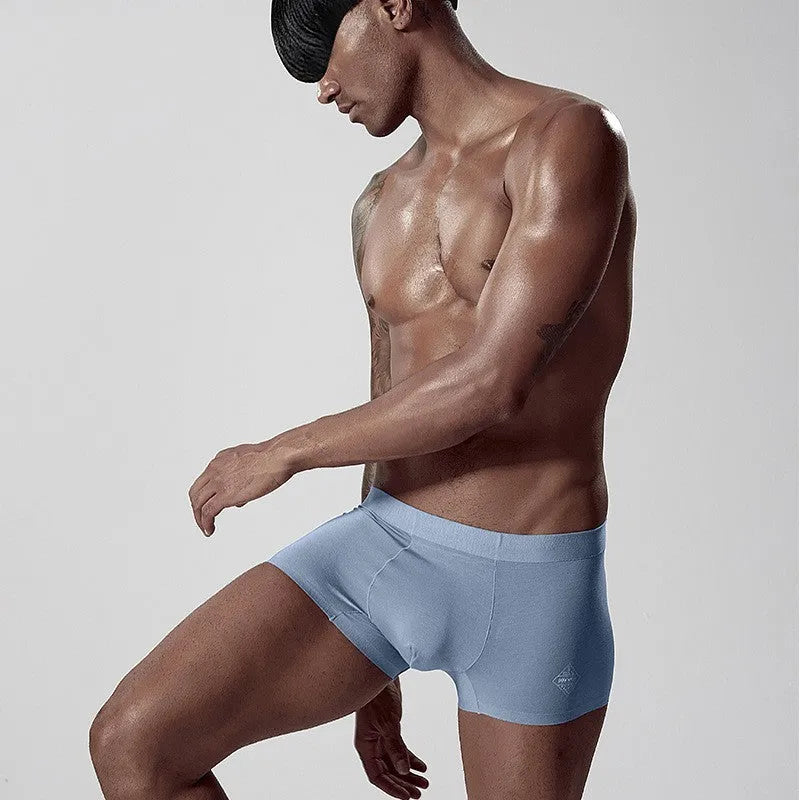 Green seamless modal men's mid waist underwear laid flat
