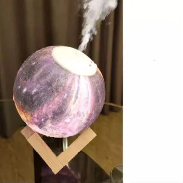 Spherical white Lunar humidifier night light with USB charging port and essential oil bottle