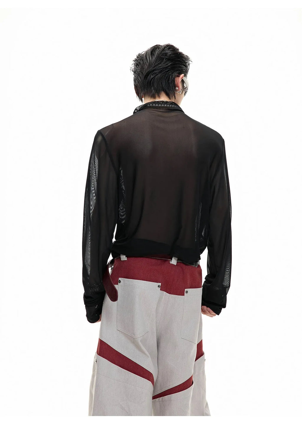 Black niche mesh slim-fit long sleeve bottoming shirt laid flat, showing trendy style and texture.