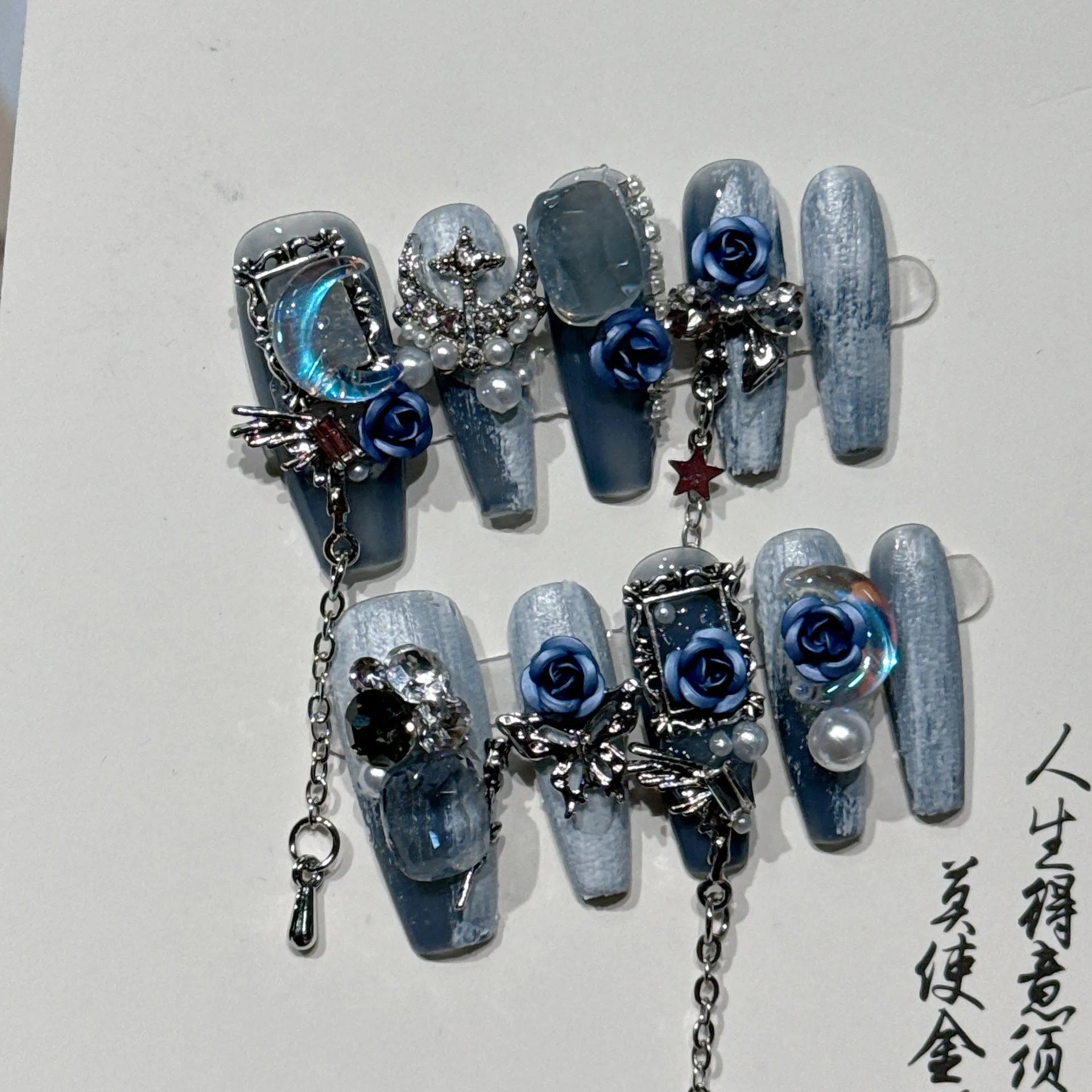 Heavy industry night blue nail stickers with ornate rose and tulip flower pattern for evening manicures.