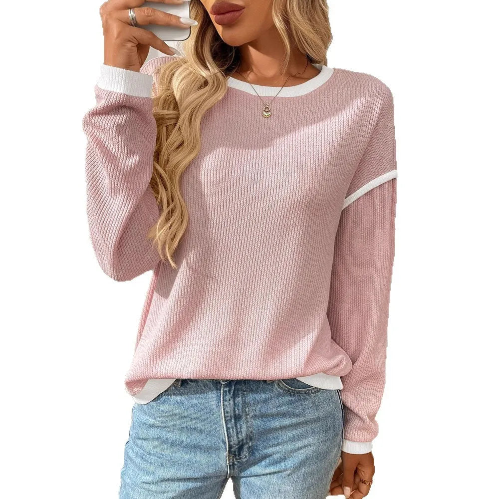 Women's loose round neck long sleeve polyester top shown in a light colour on a hanger.