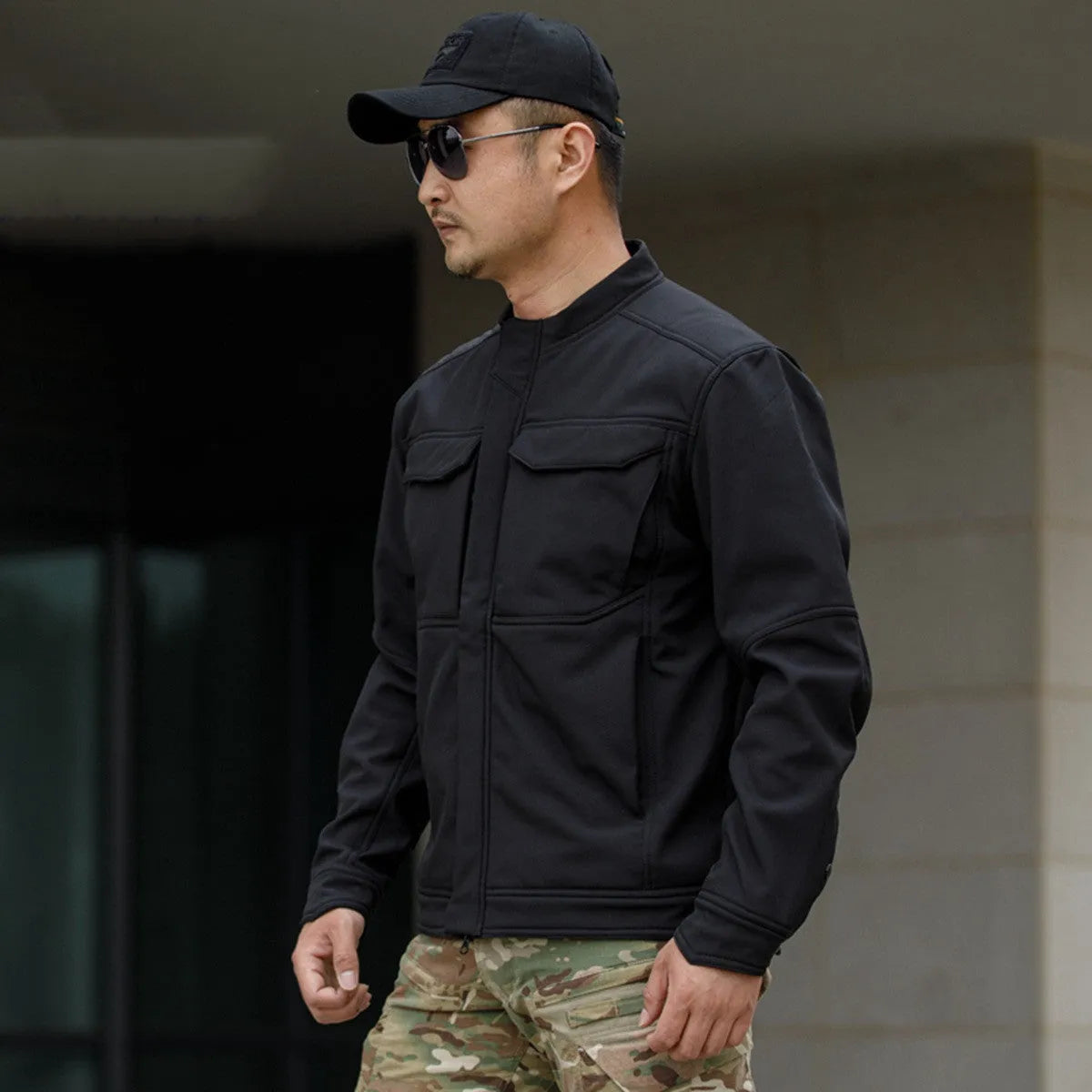 Tactical soft shell jacket in black colour for mountaineering and camping
