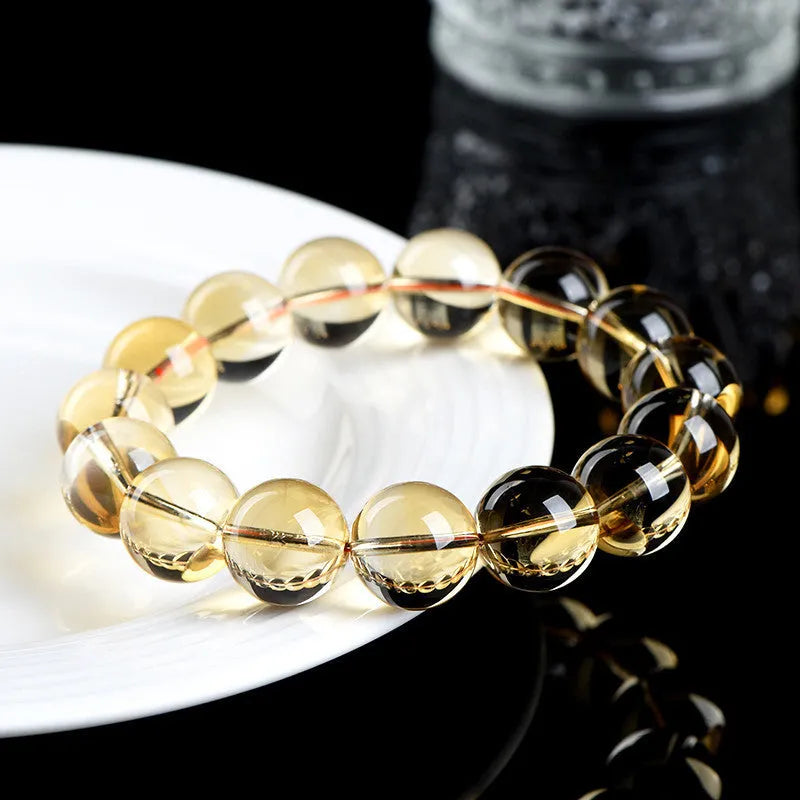 Natural citrine scattered bead ball bracelet showing 7A and 6A colour grades on a model's wrist.