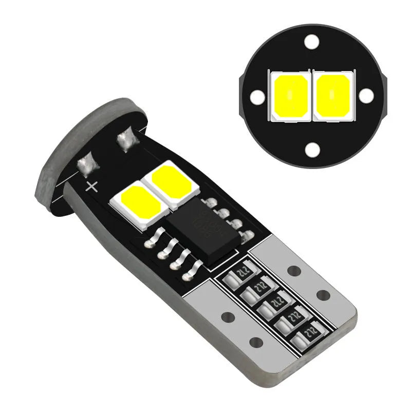 Small white 12V car number plate reading lamp with fibreglass housing.