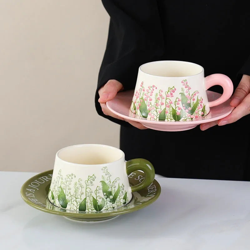 Ceramic coffee cup and saucer set with two cups, plates and stirring spoons