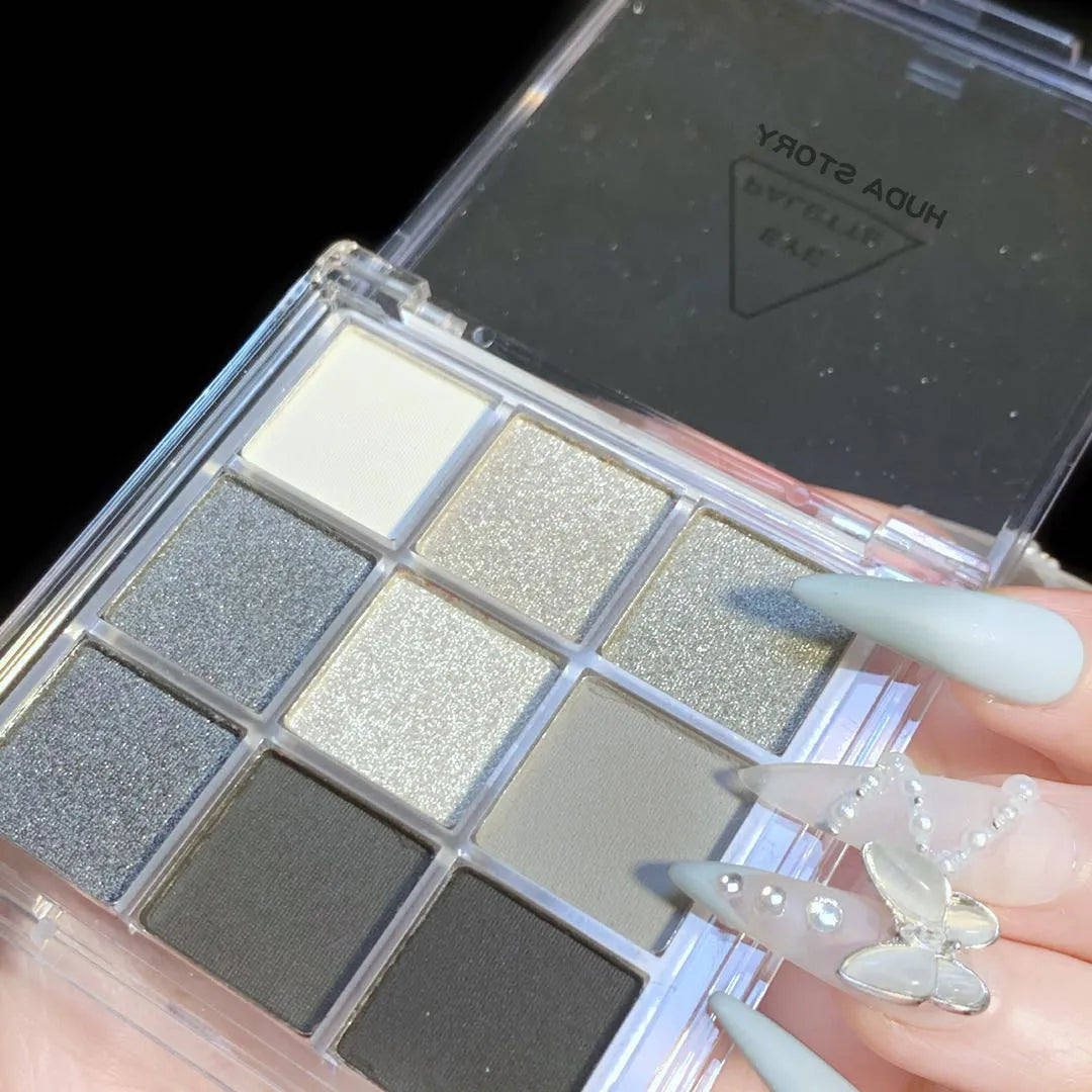 Nine-colour smoked theme eyeshadow palette showing white, silver, black, and iron grey shades