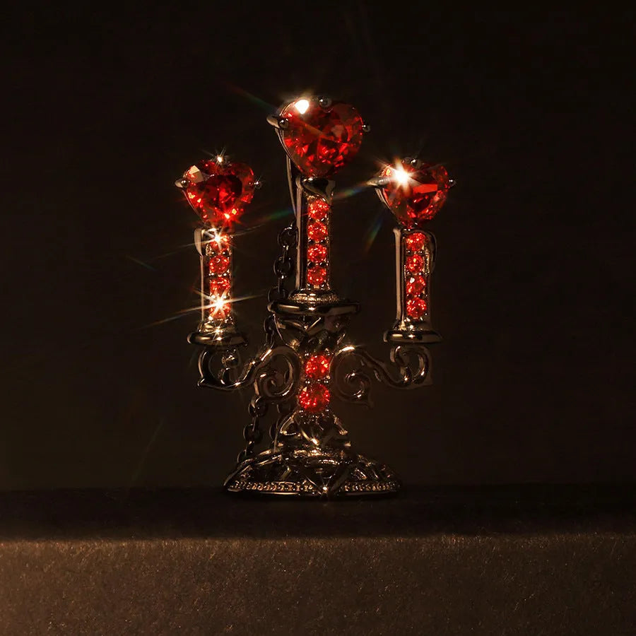 Women's retro candlestick pendant necklace on a gothic cross chain.