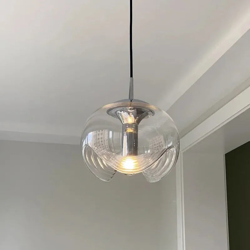 Modern minimalist glass chandelier with 25cm diameter, shown in transparent, amber, or smoky gray colour options.
