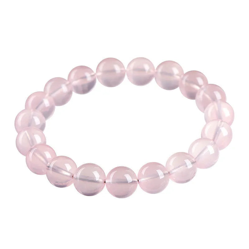 Natural starlight crystal round bead bracelet in pink, shown in a single circle design with polished beads.