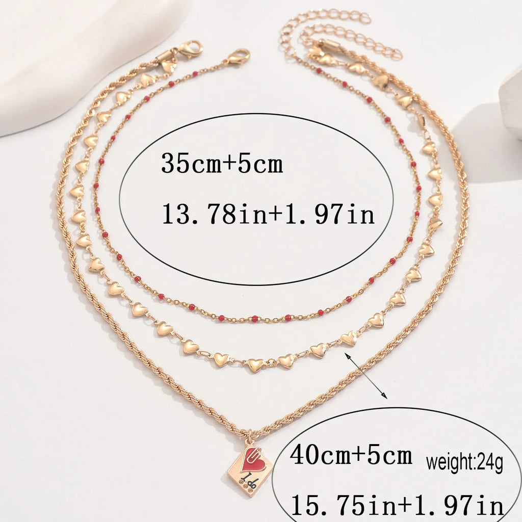 Adjustable three-layer zinc alloy clavicle chain necklace with a geometric heart pendant.