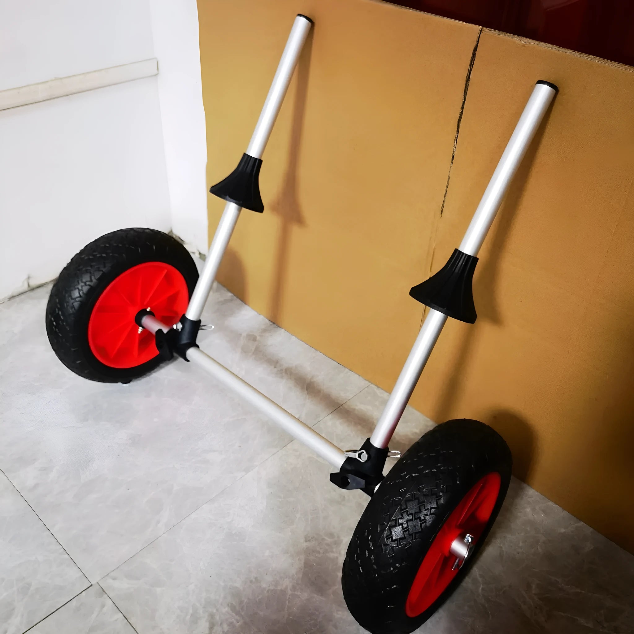 Foldable aluminium kayak trailer with upright pole platform and small cart for transport.