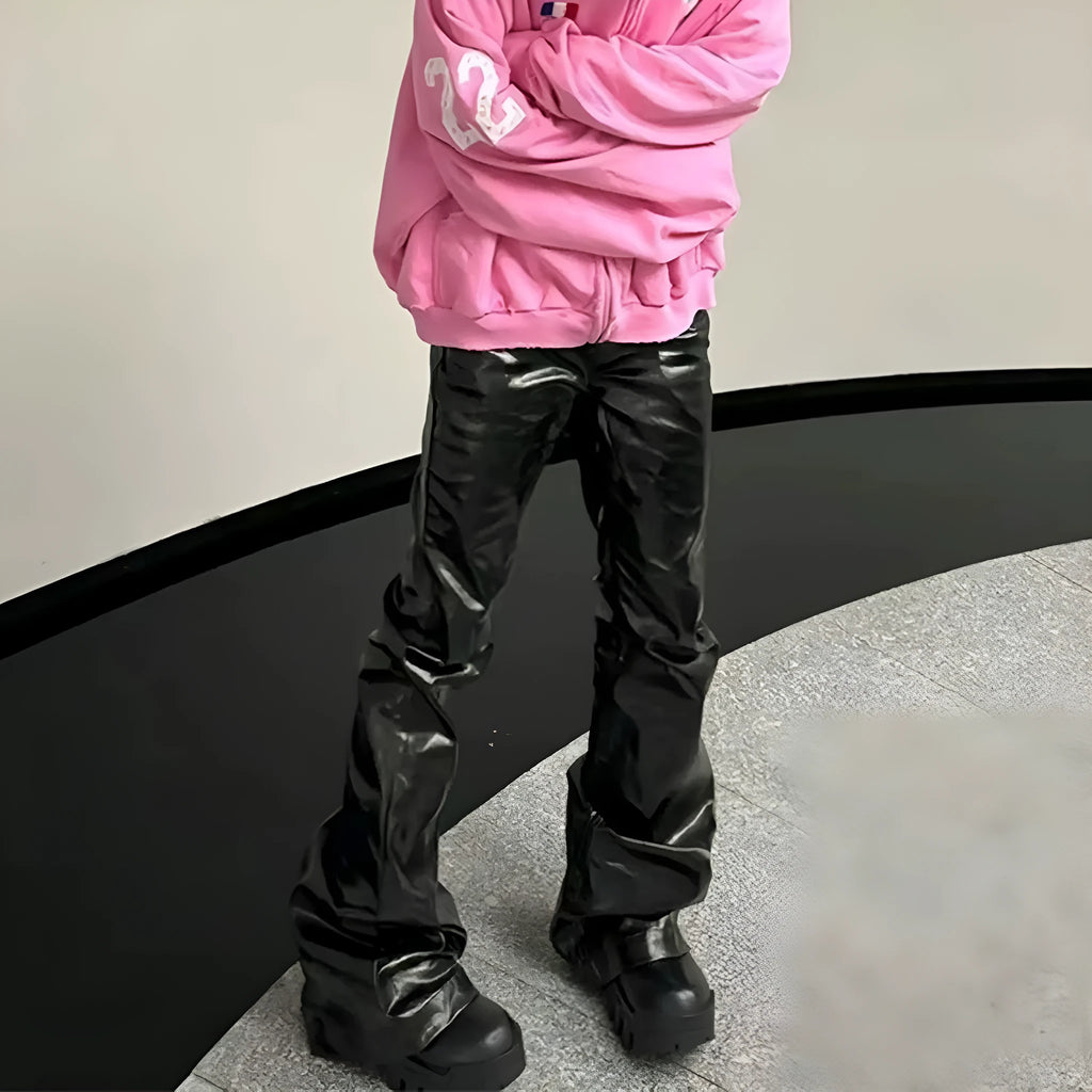 Black straight-leg skinny jeans with a shiny patent leather finish and a mid waist.