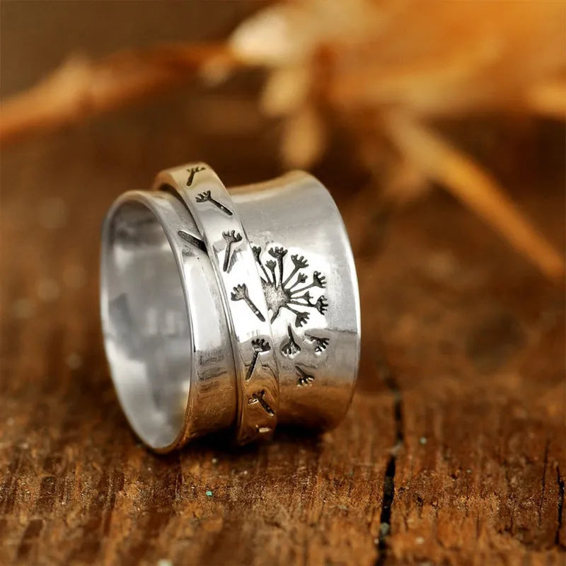 Adjustable silver flower ring with rotatable design fits five finger sizes
