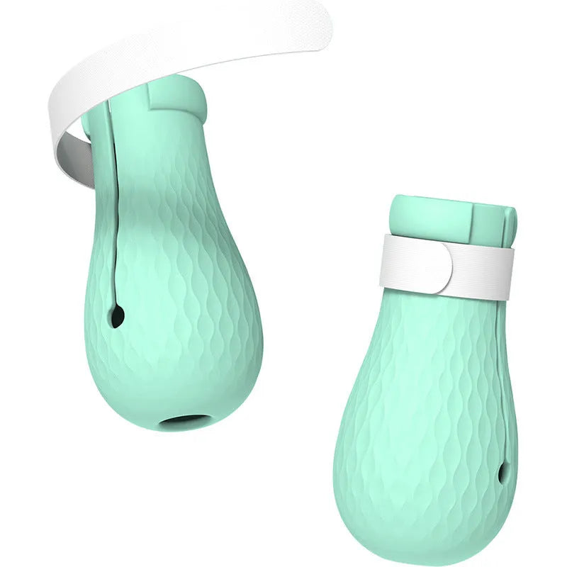 Green silicone cat paw covers with straps for scratch protection during washing and medical procedures