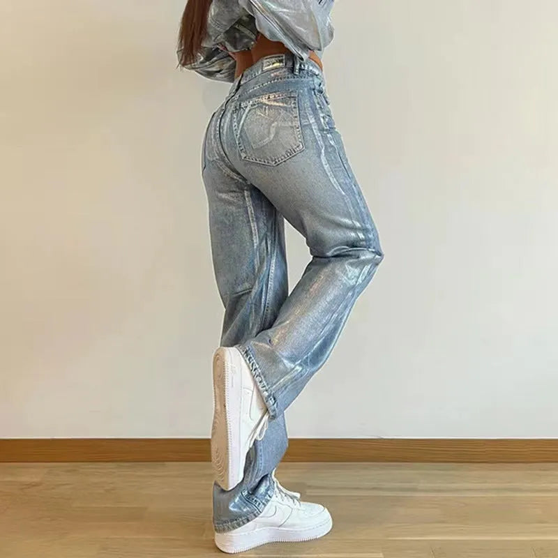 Blue high-waisted straight-leg jeans with washed denim finish on streetwear background