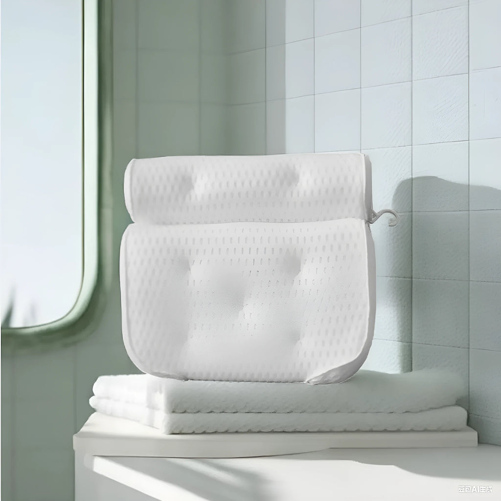 White bathtub pillow with suction cups and mesh construction measuring 37cm by 34cm