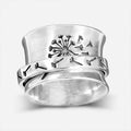 Adjustable silver flower ring with rotatable design fits five finger sizes