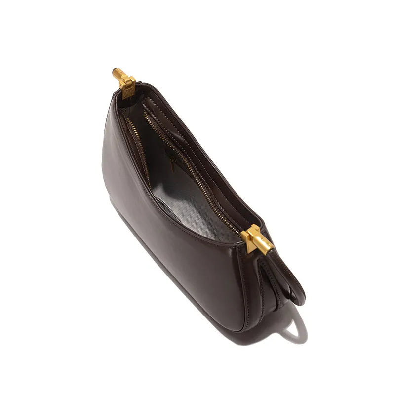 Women's oval PU leather underarm bag in multiple colours with single shoulder strap and zippered interior pouch