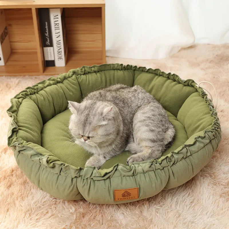 Grey and green reversible donut cat bed shown in small, medium, and large sizes