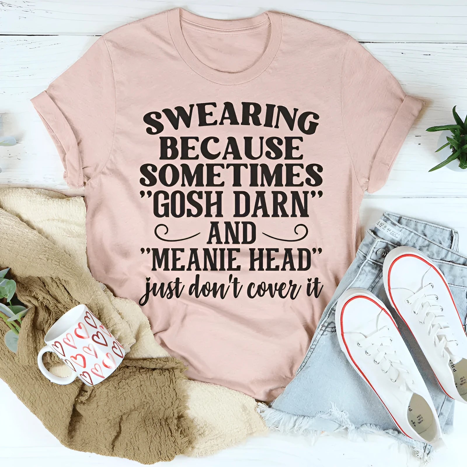 Pink couple's t-shirt with a printed design, shown in a straight fit with short sleeves.
