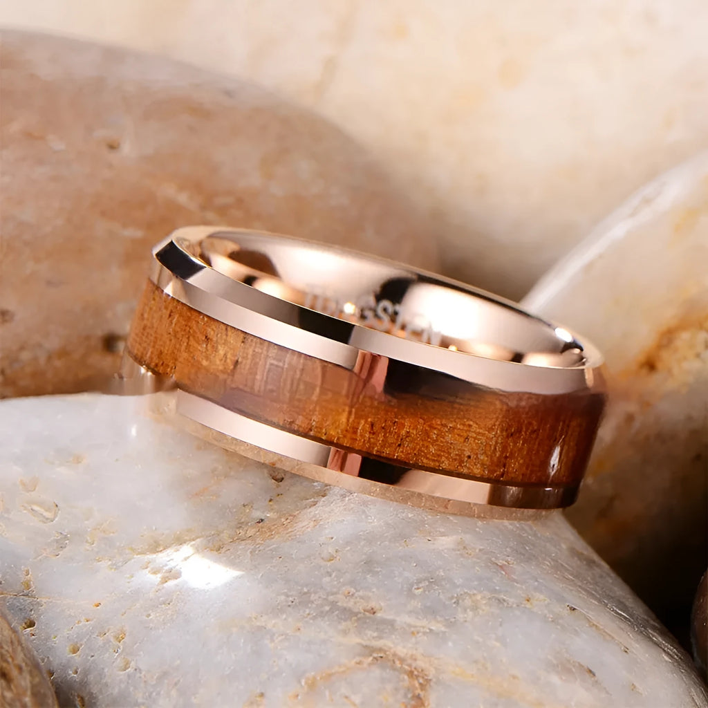 Men's 8mm wide U-shaped tungsten ring in rose gold finish on a grey background.