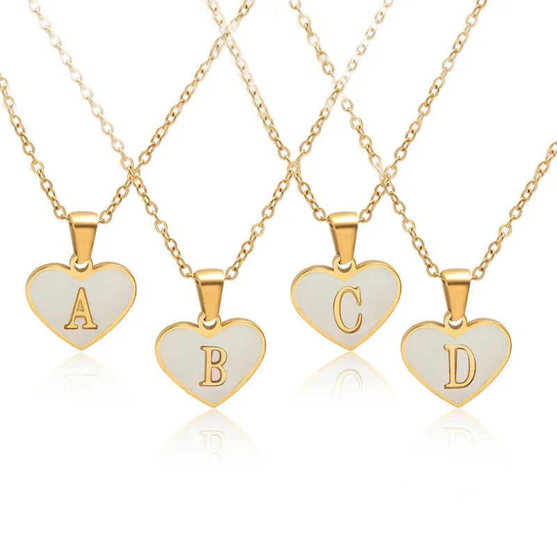 Gold-plated heart-shaped necklace with white shell pendant and personalised initial letter on 45+5cm chain