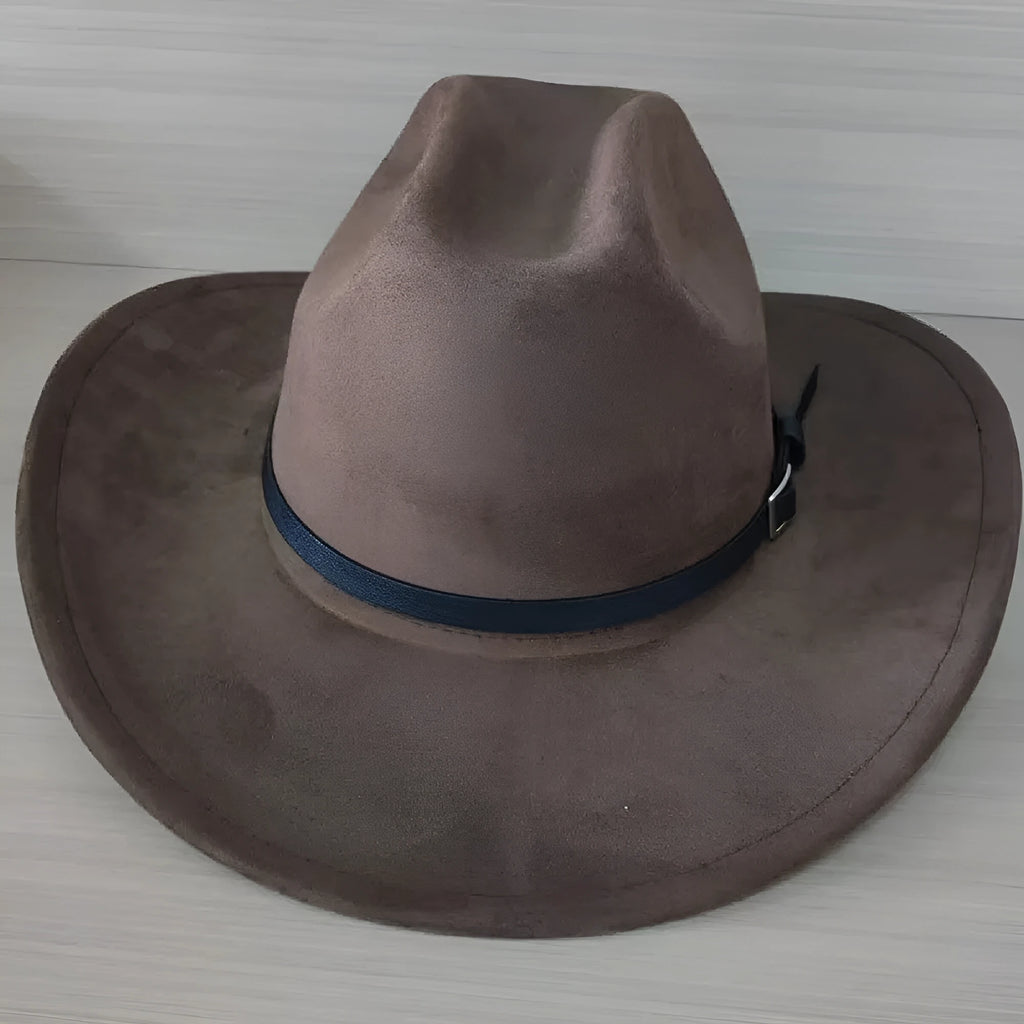 Brown leather velvet Western cowboy hat with a curved brim on a wooden post.