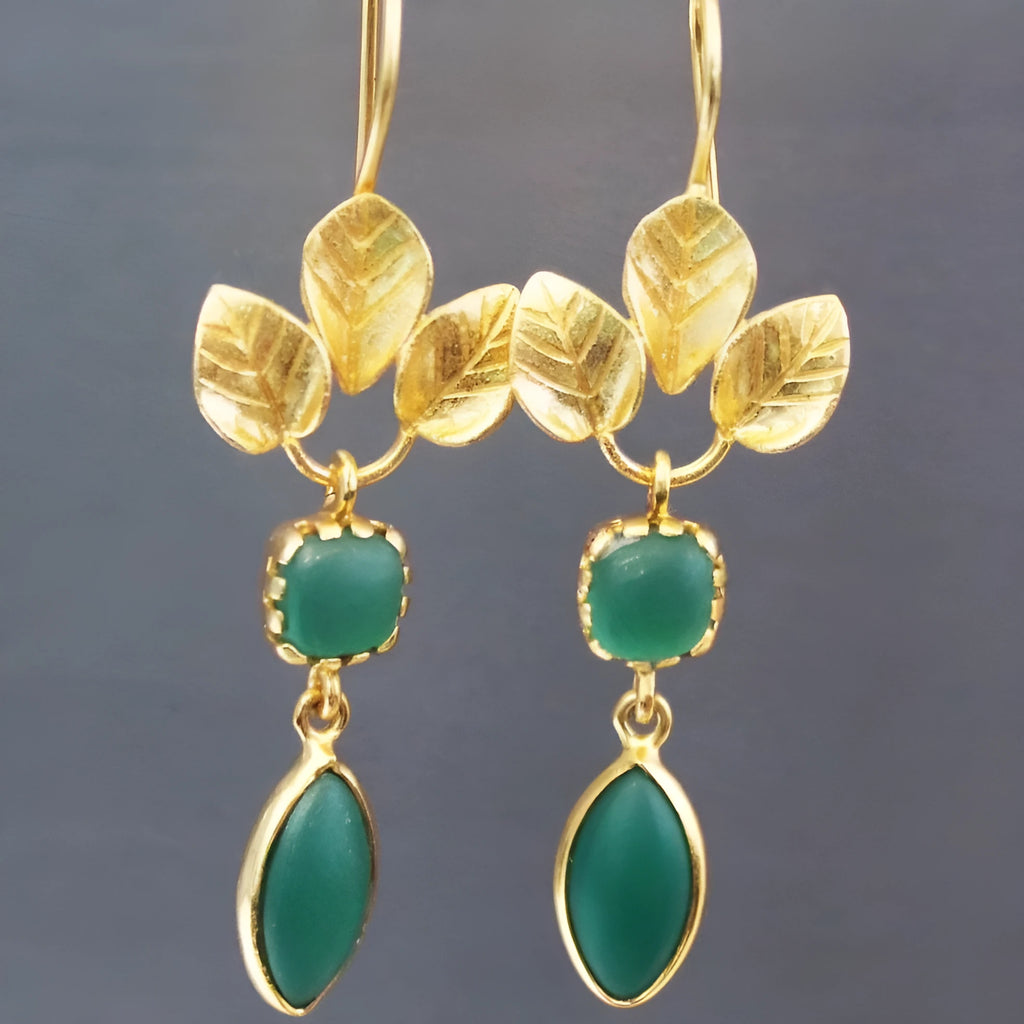 Gold drop earrings with French leaves tassel details and water droplet shape on copper alloy
