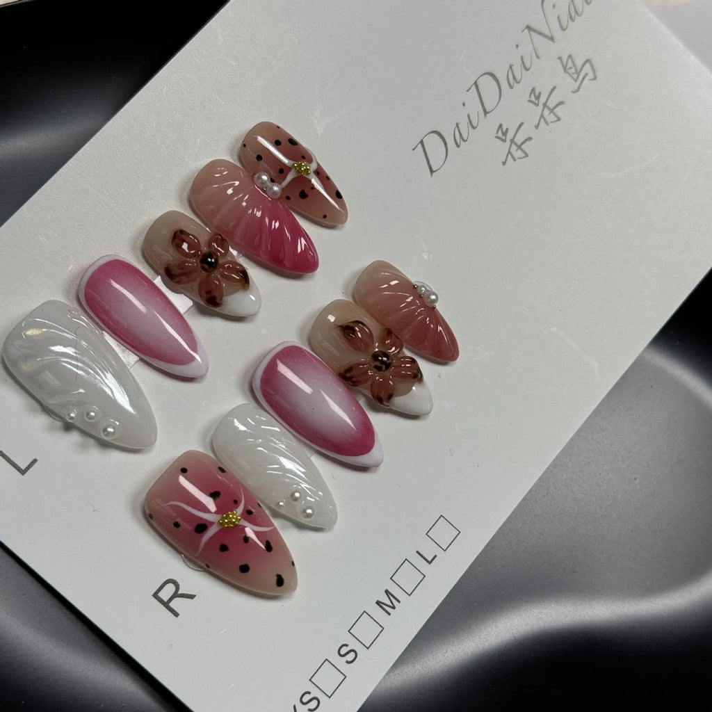 Hand-painted three-dimensional carved nail beauty patches in assorted colours and patterns.