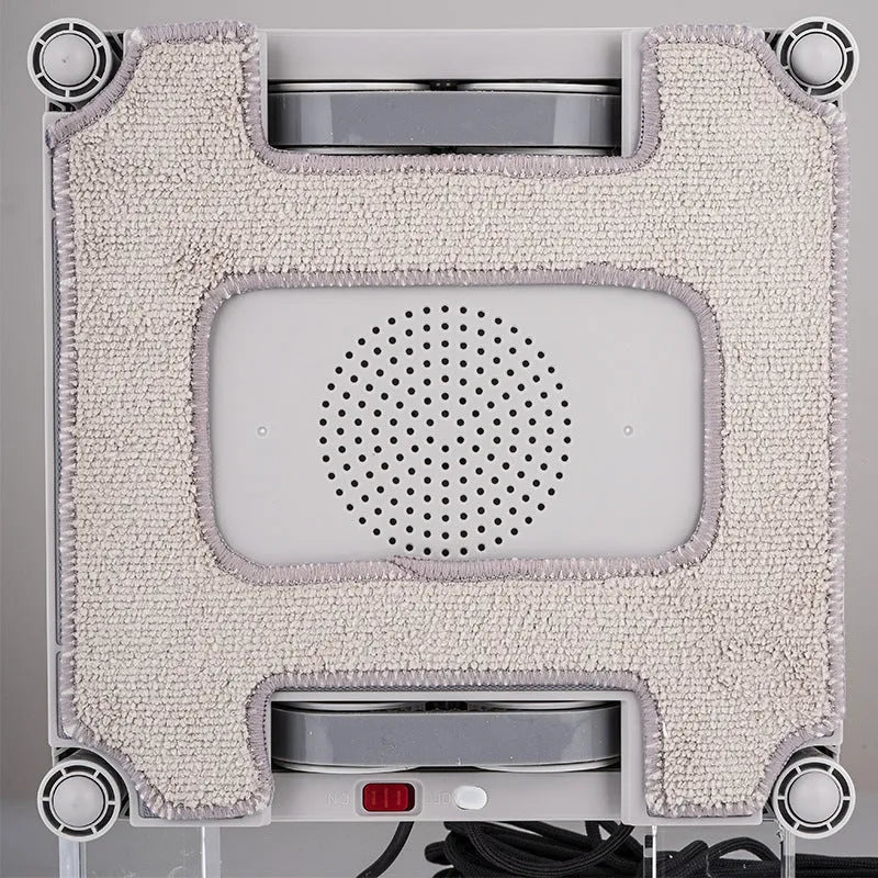 White intelligent window cleaning robot for high-rise glass surfaces, showing control app and water spray ports.