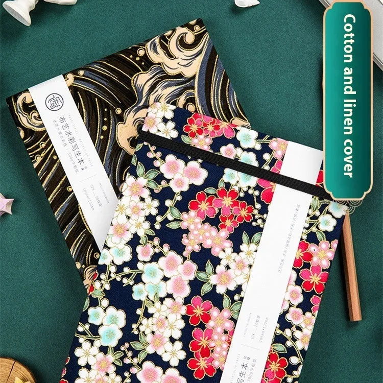 Feiluniao handmade fabric watercolour notebook showing cover design, 185mm long.