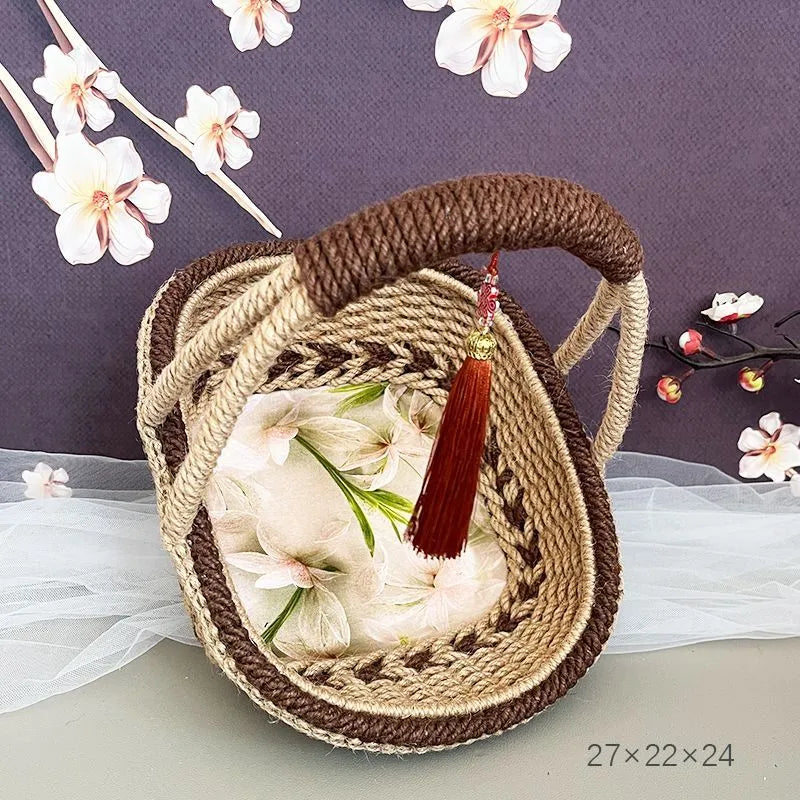 Hand-woven straw basket with hemp rope detailing in rustic farmhouse style