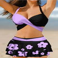 Purple women's bikini with lace-up front and matching high-waisted split skirt.