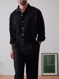 Black pinstriped polyester button-down shirt with regular fit and long sleeves