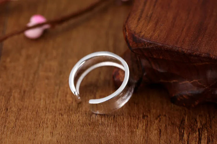 Geometric open ring in frosted sterling silver with adjustable opening