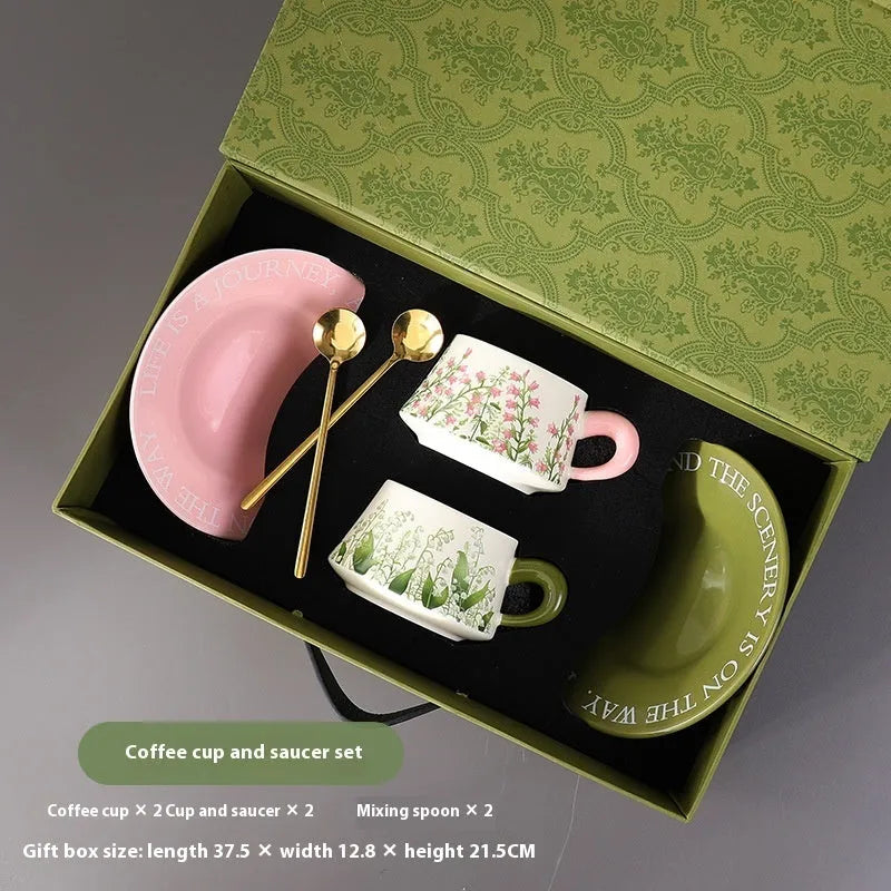Ceramic coffee cup and saucer set with two cups, plates and stirring spoons