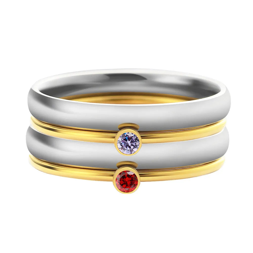 Close-up of a gold electroplated titanium steel ring with an engraved December birthstone geometric design.