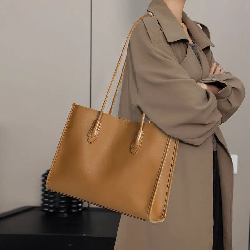 Women's genuine leather commuter tote bag in golden brown with double straps and stitching detail