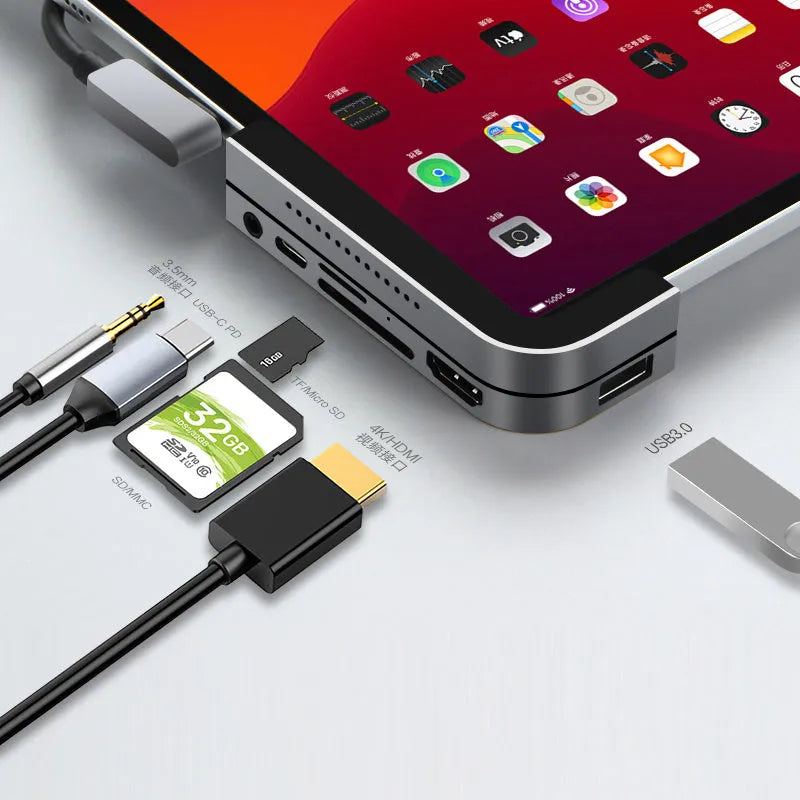 Silver aluminium grey USB-C docking station and converter hub for iPad Pro with multiple ports.