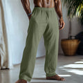 Men's straight-leg cotton linen casual trousers in light green, shown with pockets.