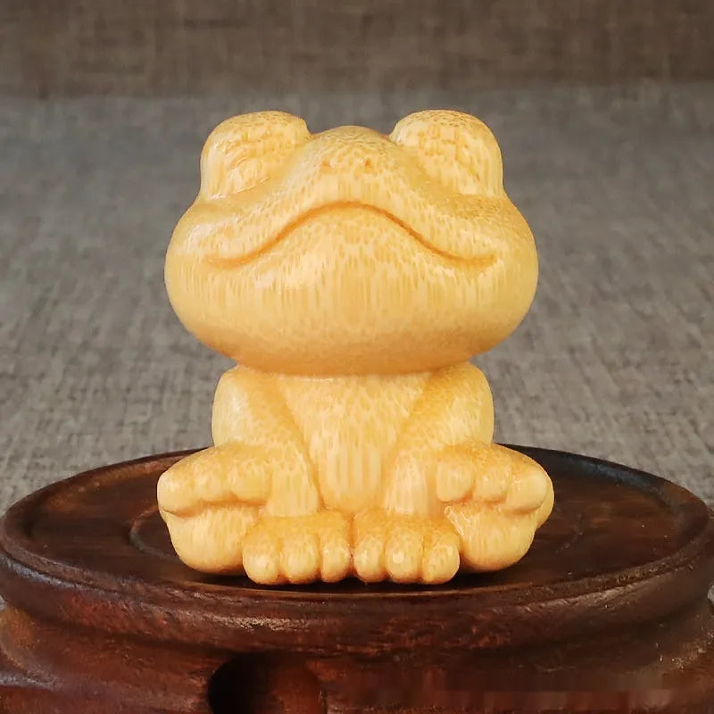 Solid bamboo smiling frog carving ornament measuring 5cm height with 4.5cm diameter