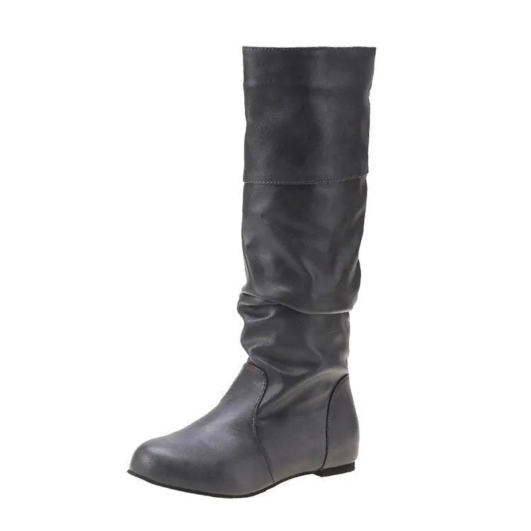 Women's flat ankle boots in black with a round toe, slip-on design, and high cylinder cut.