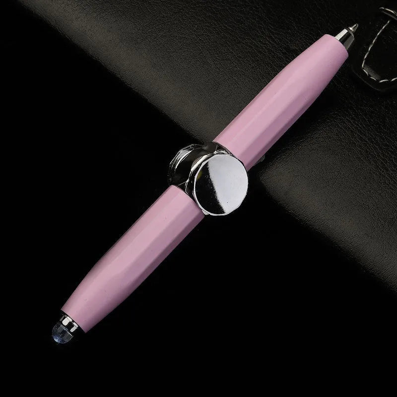 Metal LED spinning gyro ballpoint pen in hand, showing fidget spinner top and pen tip.