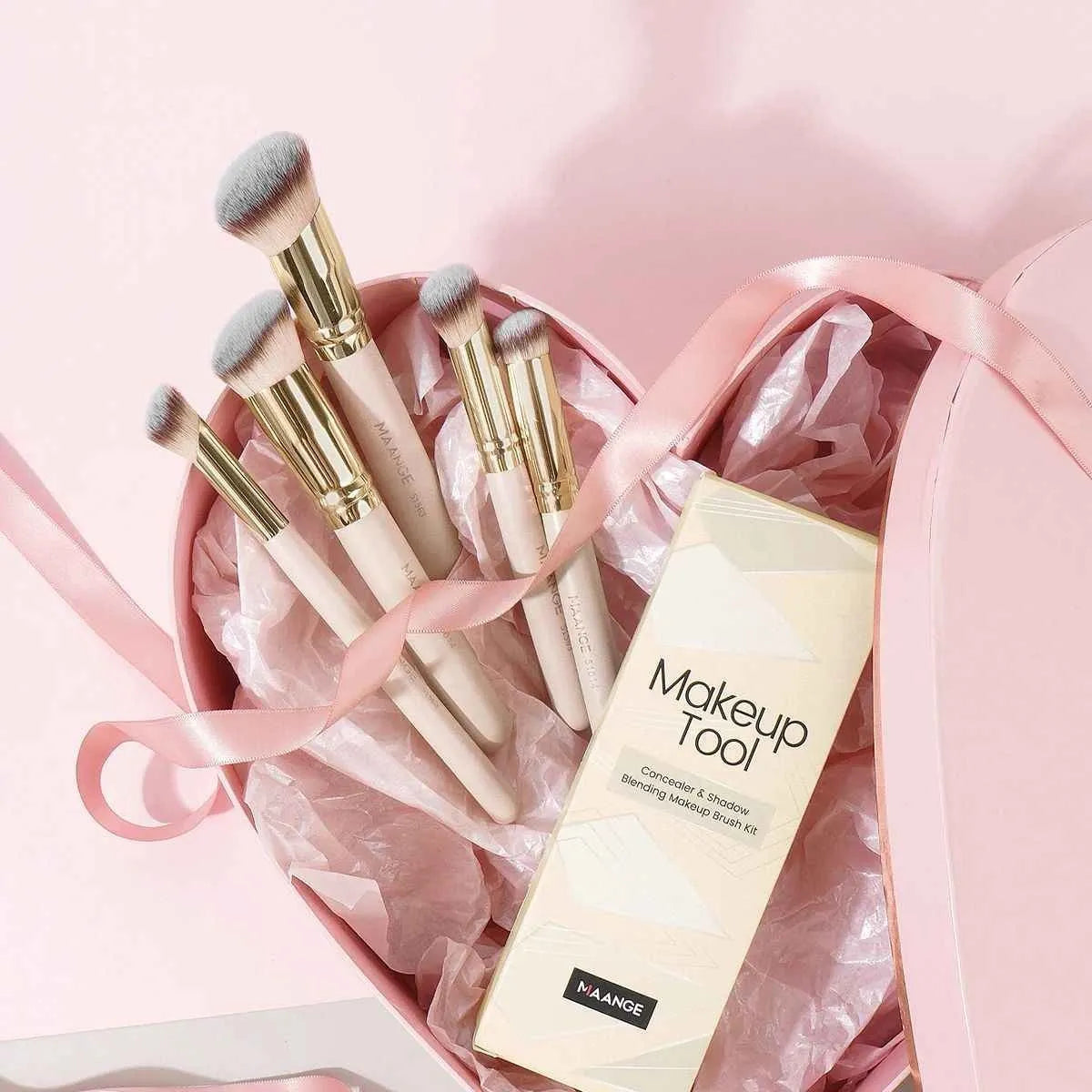 Five angled apricot-coloured makeup brushes for powder blush and foundation application