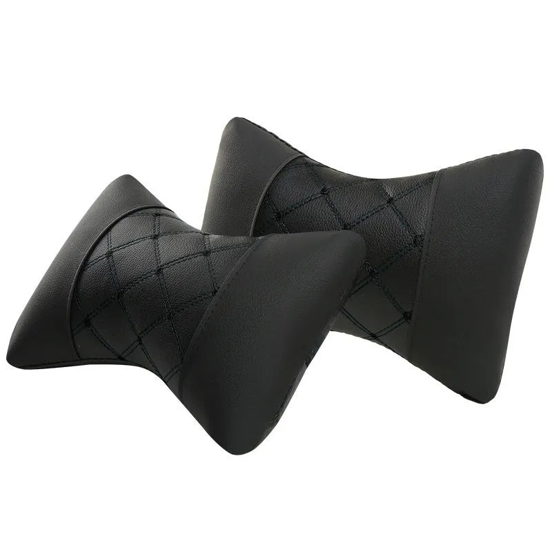 Leather quilted car headrest neck pillow with diamond check pattern in black with contrasting stitching