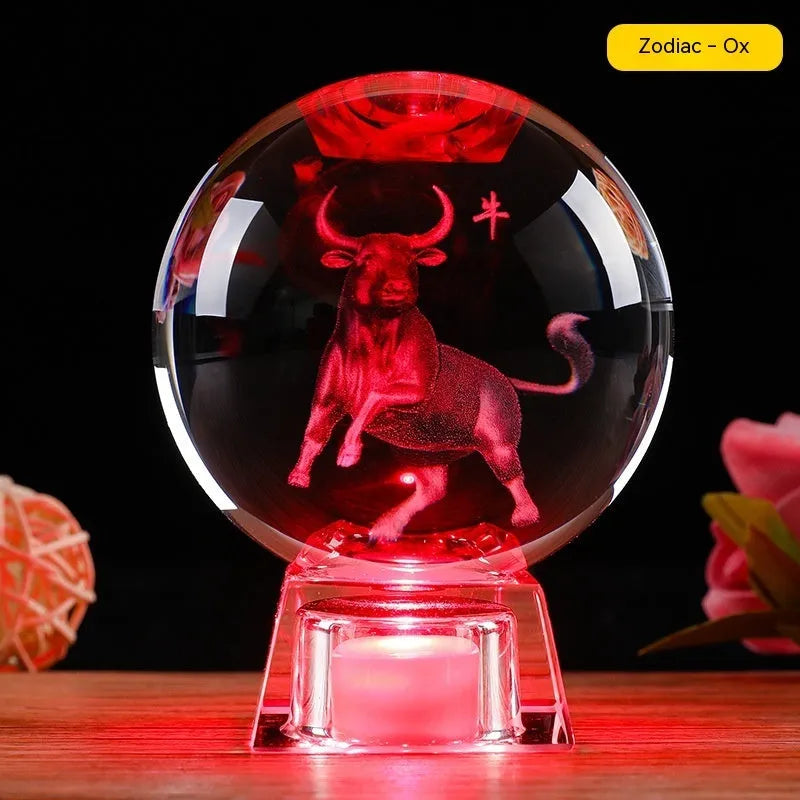 White crystal ball luminous ornament featuring a Chinese zodiac animal inside, displayed with its electronic base.