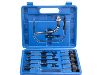 13-piece automatic transmission oil refuelling kit with hand pump and assorted connectors on a white background.