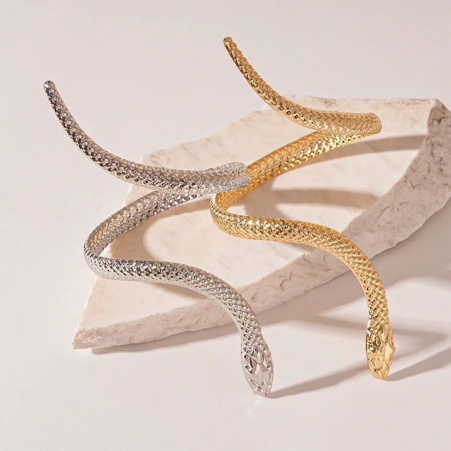 Snake-inspired ring and bracelet set with exaggerated twisted winding design in electroplated metal